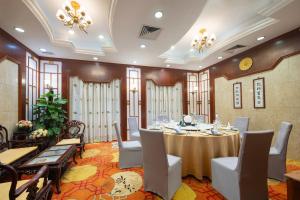 a large banquet room with a table and chairs at Liuhua Hotel in Guangzhou