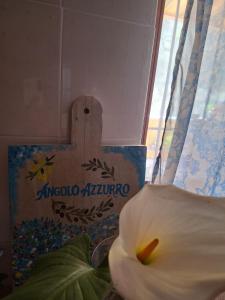 a close up of a white flower next to a cross at Angolo Azzurro in Asciano Pisano