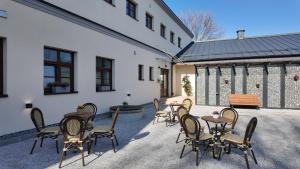 a group of chairs and tables on a patio at Penzion Hněvotín 88 in Hněvotín
