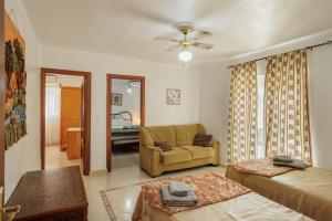 a living room with a couch and a chair at El Llano in Sierra de Yeguas