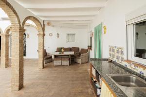 a living room with a couch and a table at El Llano in Sierra de Yeguas