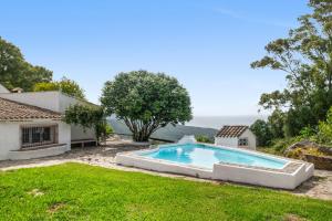 a swimming pool in the yard of a house at Cortijo Cantarranas - Tarifa in Tarifa