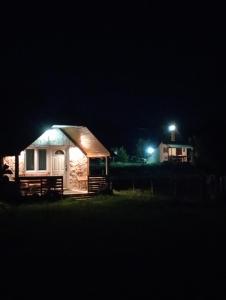 a small cabin at night with lights on at Konak in Podgorica