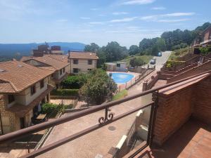 a view of a pool from the balcony of a house at Bellavista in Piedralaves