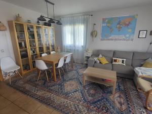a living room with a couch and a table at Bellavista in Piedralaves