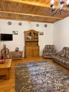 a living room with a couch and a table at Плай in Khmelnytskyi