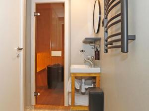 a bathroom with a sink and a mirror at Bjursås Bergsgård in Bjursås +22 photos