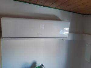 a overhead light hanging from a wall in a room at Apartmány Kroměřížsko in Hulín