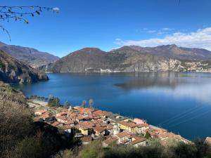 a small town on the shore of a large lake at La Casa sulla Roccia in Pisogne +83 photos