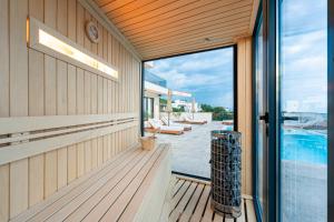 a balcony with a view of a swimming pool at Krimovica Villas in Budva