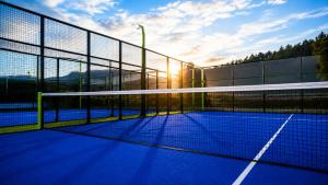 a tennis court with a net on a court at Grand Hotel Bansko - Fitness & SPA in Bansko