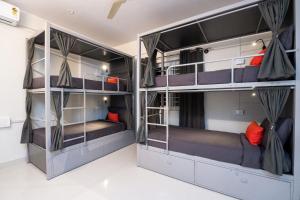 two bunk beds in a room at Loop by Zolo HSR Layout, Bangalore in Bangalore
