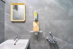 a bathroom with a sink and a mirror at Loop by Zolo HSR Layout, Bangalore in Bangalore +38 photos