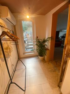 a living room with a window and a tile floor at Studio Smart&Cosy in Porto-Vecchio