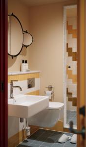 a bathroom with a sink and a mirror at The July - Capel Street in Dublin +22 photos