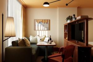 a living room with a couch and a table at The July - Capel Street in Dublin