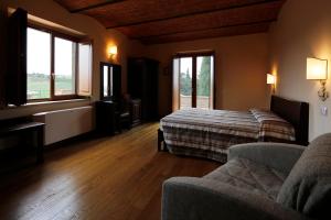 Posteľ alebo postele v izbe v ubytovaní Agriturismo Poggio Al Tufo