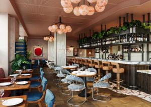 a restaurant with tables and chairs and a bar at The July - Capel Street in Dublin