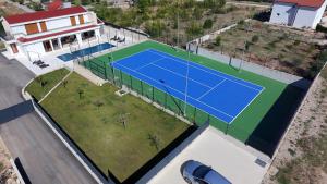 an overhead view of a tennis court on a house at Villa After Set Heaven in Čapljina