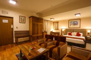 Ένα ή περισσότερα κρεβάτια σε δωμάτιο στο Atithi Resort & Spa