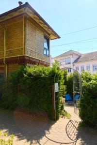 a brick house with a gate and a fence at Stellwerk Lörrach in Lörrach
