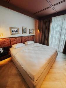 a bedroom with a large bed in a room at The Noria Hotel in Arsuz