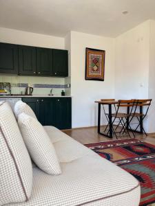 a living room with a couch and a table at Hotel Villa Tokur in Datca