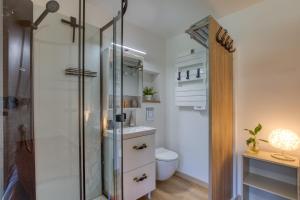 a bathroom with a shower and a toilet at Chambre jardin in Lunel +11 photos