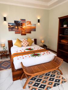 a bedroom with a large bed in a room at Digwa Beach Chalet in La Digue