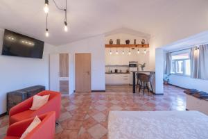 a living room with a couch and a table at Studio apartma Kamin in Nova Vas +37 photos