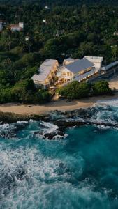 an aerial view of a resort on the beach at Asaya Sands Mirissa in Mirissa
