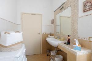 a bathroom with a sink and a mirror at Casa Ortensia in Spoleto +26 photos