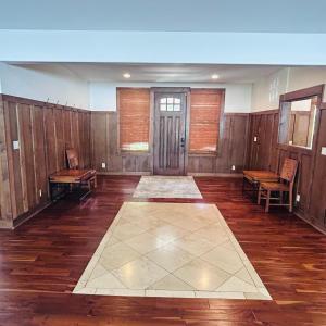 an empty room with wooden walls and wooden floors at Hale Halai in Hauula +37 photos