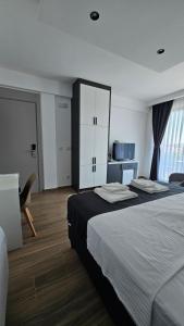 a hotel room with two beds and a mirror at AnDora in Donji Štoj