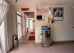an empty hallway with a machine in a building at Wangsa Village Inn in Ulu Tiram