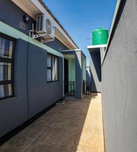 an empty hallway of a house with a building at Area 46 BnB in Lilongwe