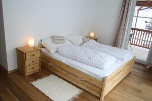 Llit o llits en una habitació de Ferienresidenz Leogangerhof