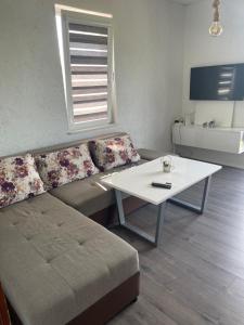a living room with a couch and a table at Villa Apartments STEFAN - Ramne Ohrid in Ohrid