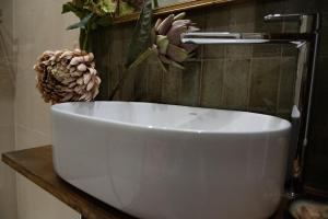 a white sink on a counter in a bathroom at Casale dei cappuccini in Scurcola Marsicana