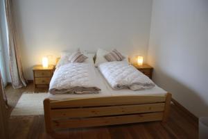 Llit o llits en una habitació de Ferienresidenz Leogangerhof