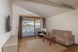 a living room with a couch and a table at Beach 222 Oludeniz in Oludeniz