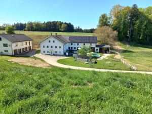 an aerial view of a house with a yard at Sweet Home Alpacas in Timelkam
