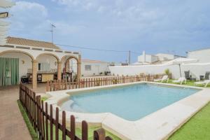 a swimming pool in the backyard of a house at El Llano in Sierra de Yeguas