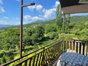 a balcony with a view of the mountains at Villa Apartments STEFAN - Ramne Ohrid in Ohrid
