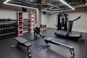 a gym with two treadmills and a treadmill at Turing Locke Cambridge in Cambridge