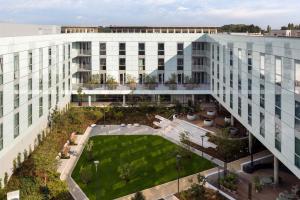an aerial view of a building with a courtyard at Turing Locke Cambridge in Cambridge