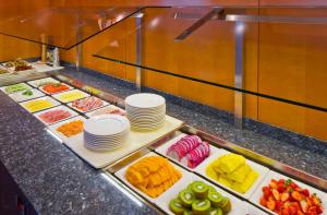 a buffet line with many different types of food at Hotel Penz West in Innsbruck