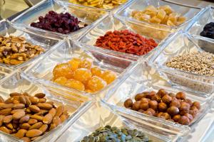 a display of different types of nuts and dried fruits at Hotel Penz West in Innsbruck