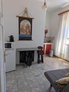 a kitchen with a counter and a refrigerator and a table at Seaside Villa Katrine in Banjol +36 photos