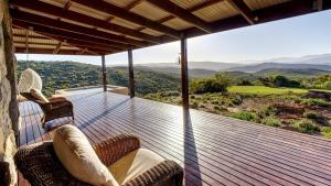 a deck with chairs and a view of the mountains at Eldorado TopHouse in McGregor